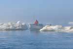 Boating in the fog among dangerous ice floes